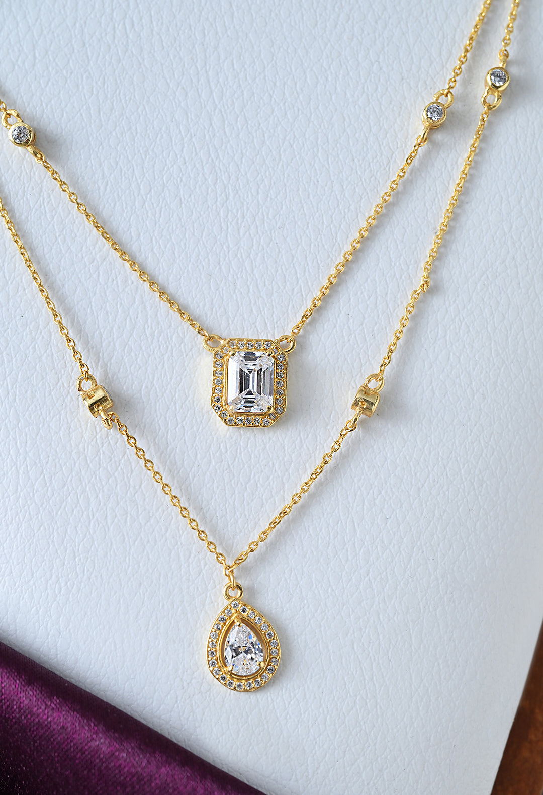 Chain necklace with teardrop and rectangle solitaire